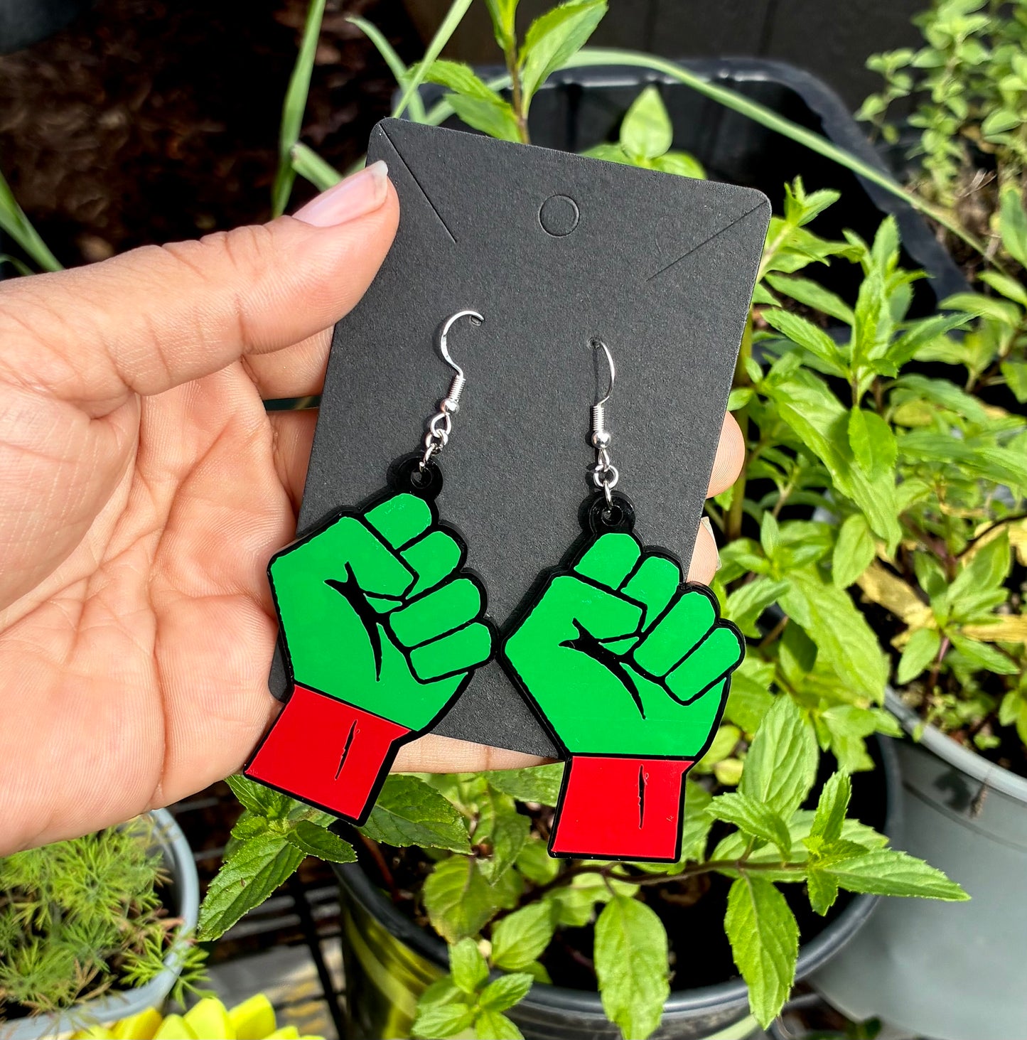 Green & black fist earrings