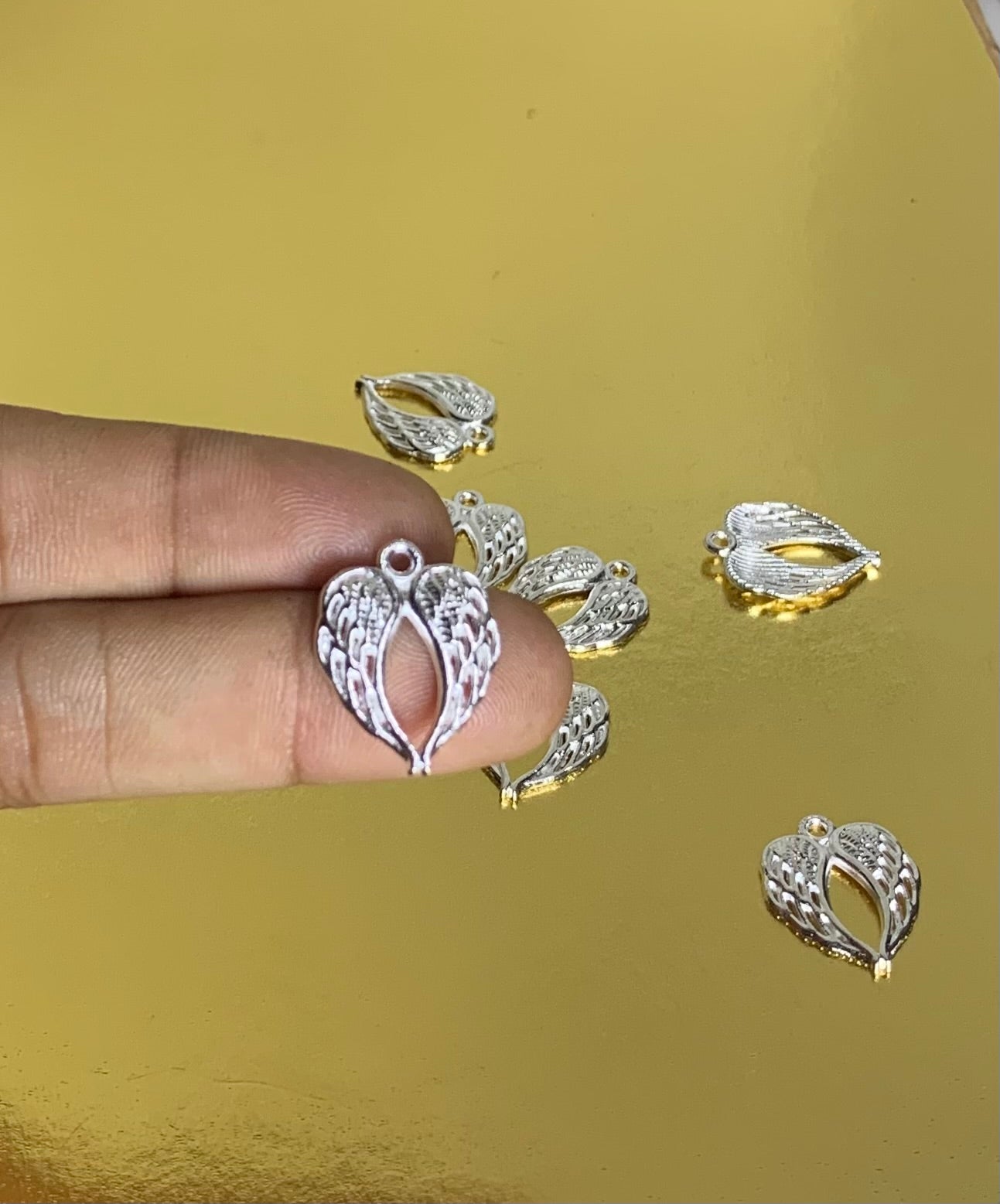 Angel wing charm