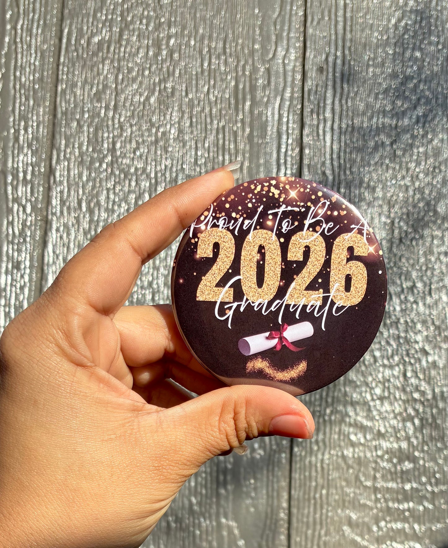 Black and gold graduate buttons