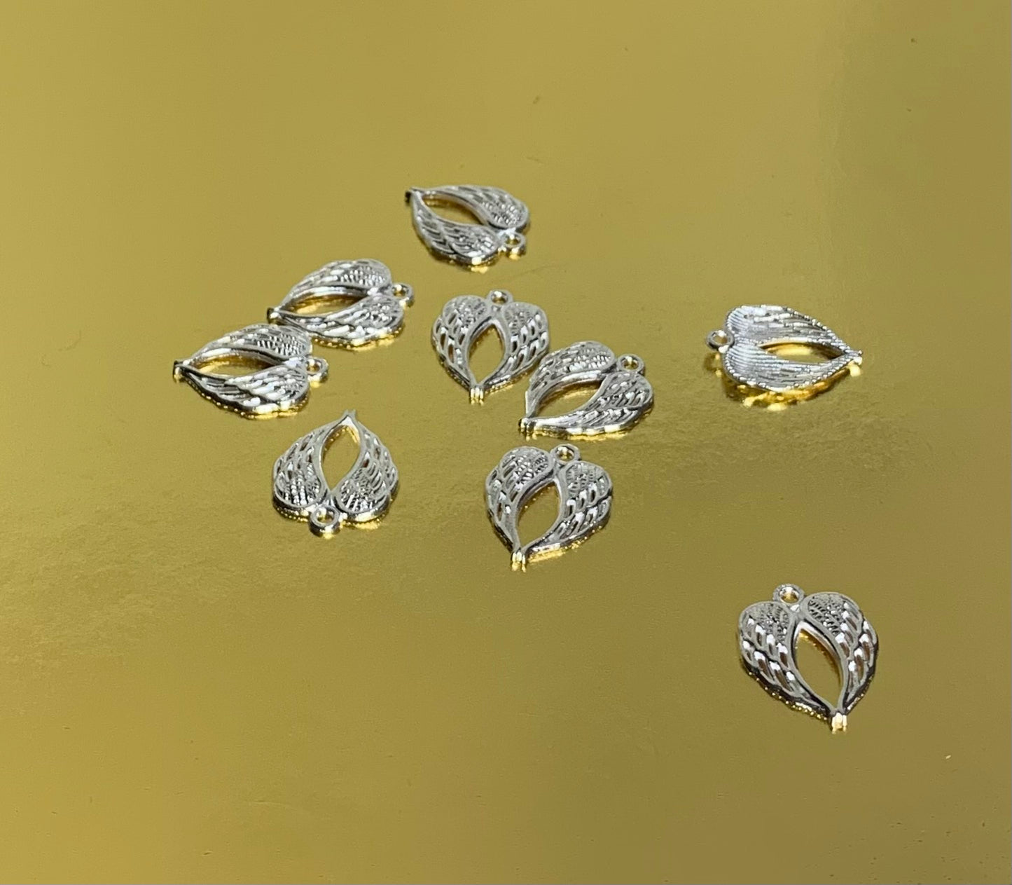 Angel wing charm