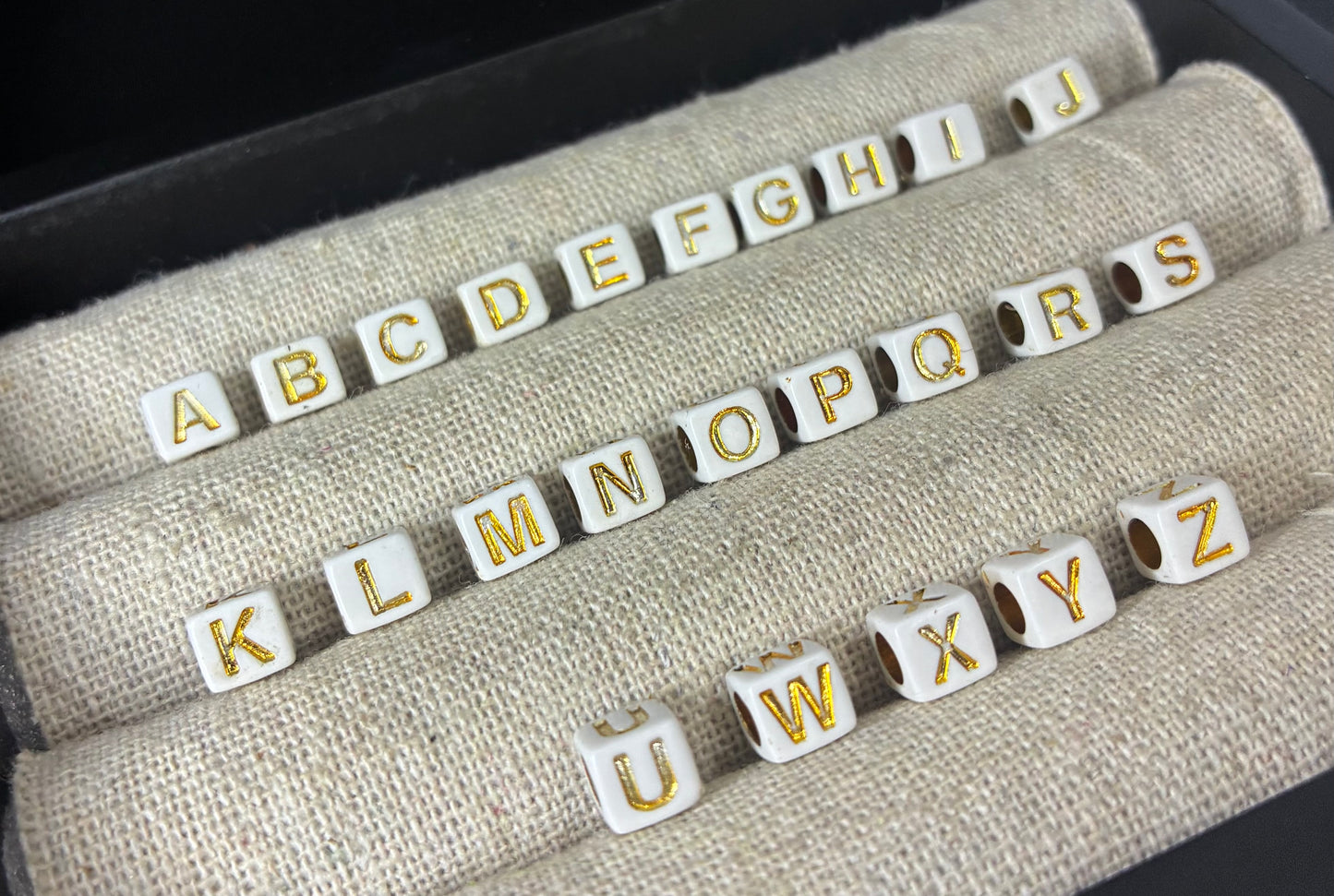 White and gold alphabet beads