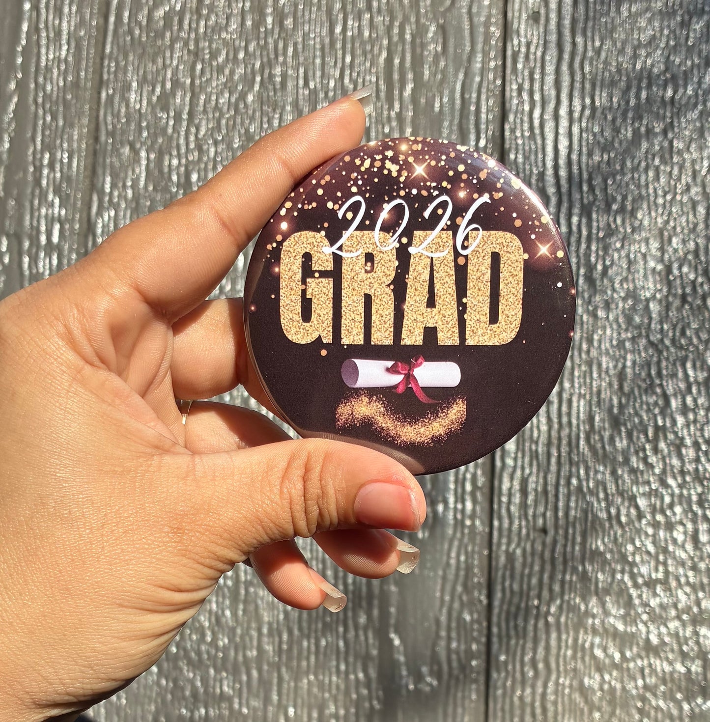 Black and gold graduate buttons