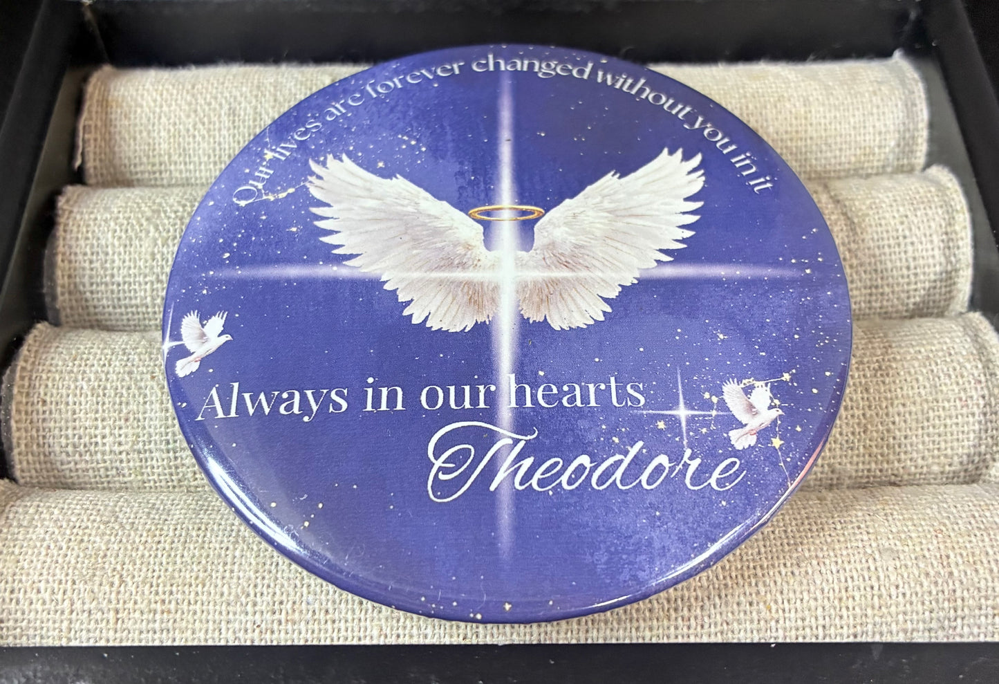 Blue and white memorial funeral button