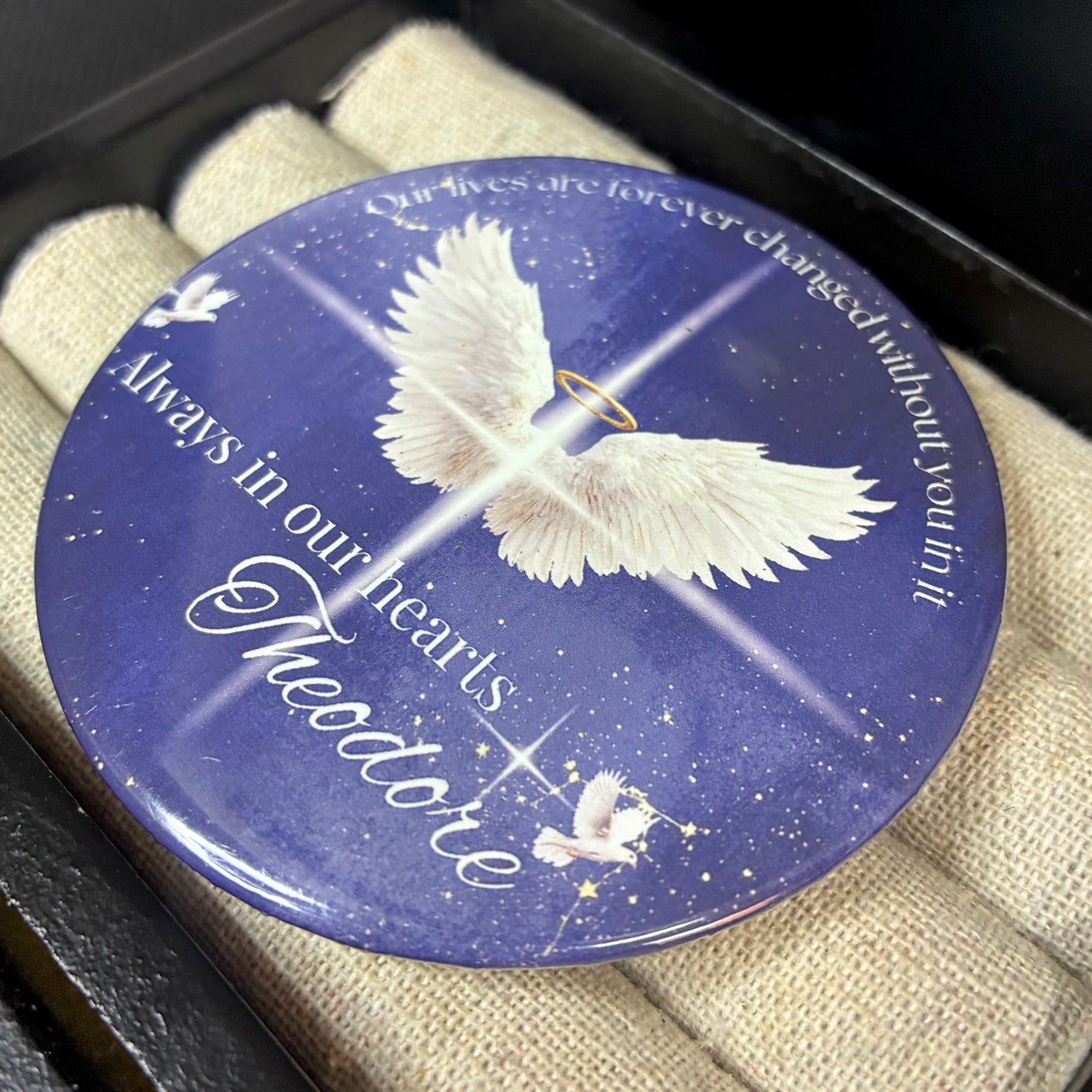 Blue and white memorial funeral button