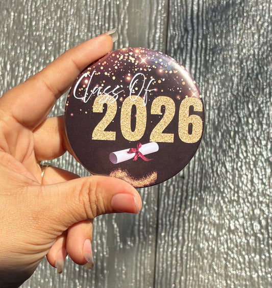 Black and gold graduate buttons